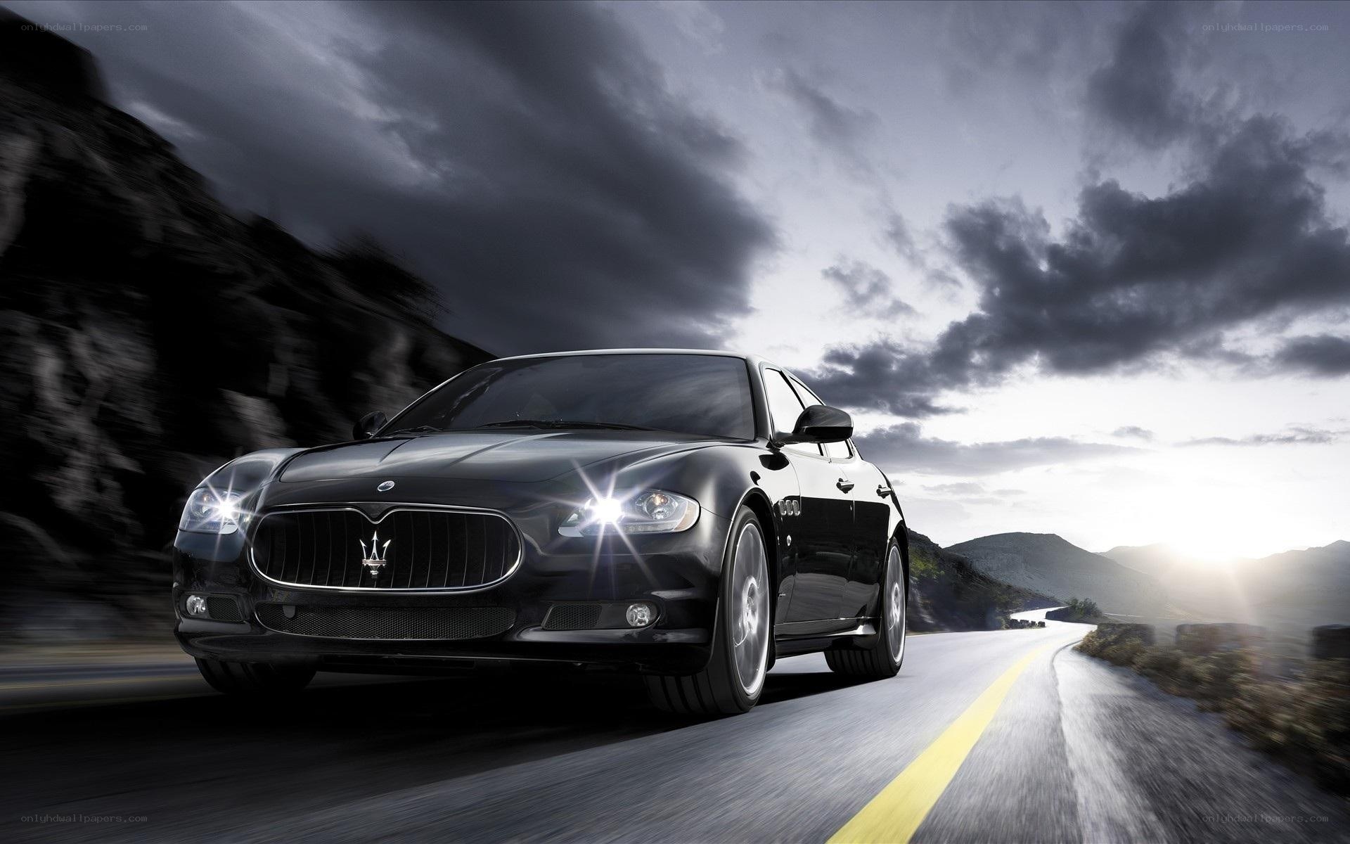 Black Maserati on mountain road