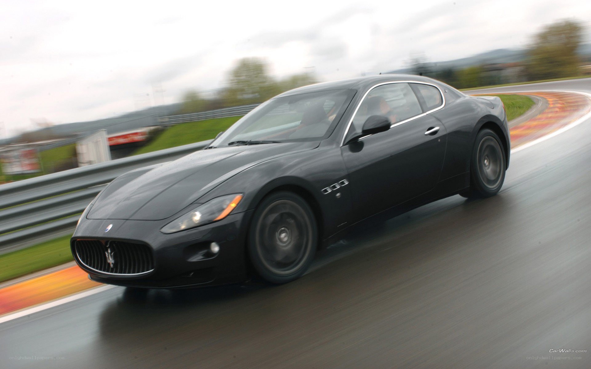 black maserati on racetrack