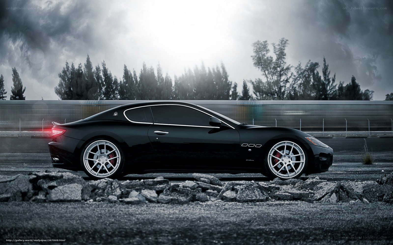 Black Maserati on racetrack