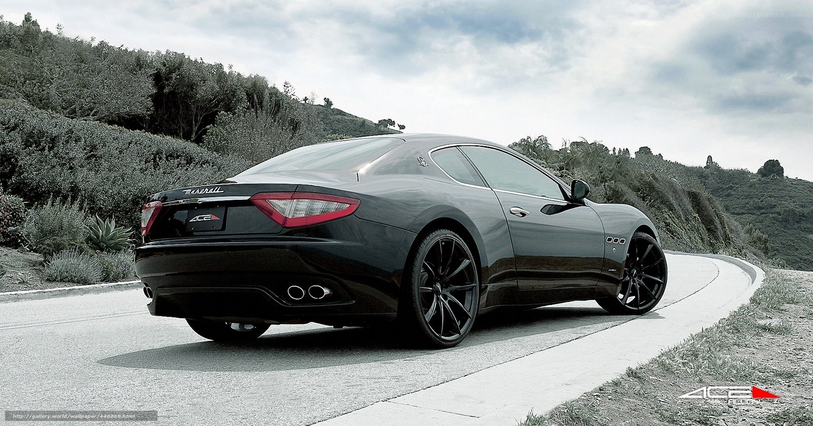 black maserati on winding road