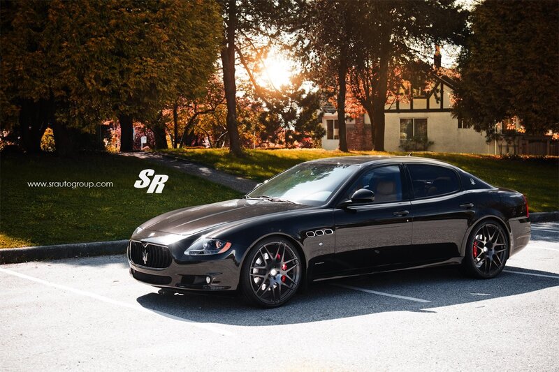 Black Maserati parked at sunset