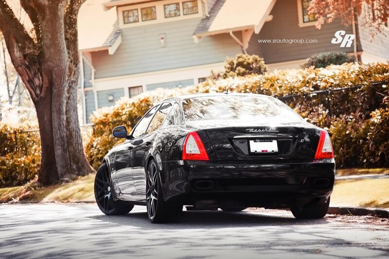 black maserati parked on street