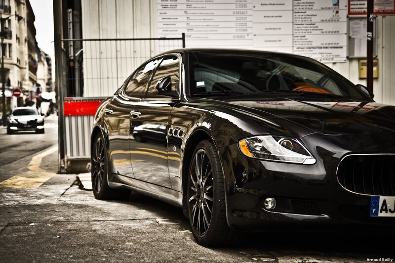 Black Maserati parked on street