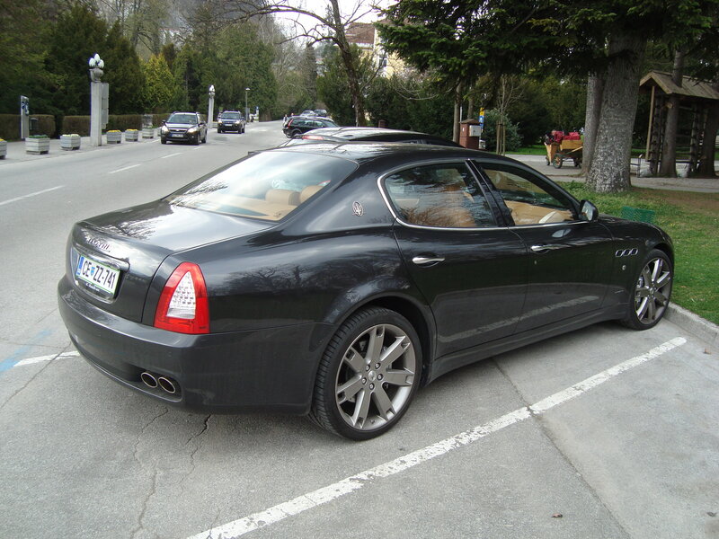 Black Maserati parked on street