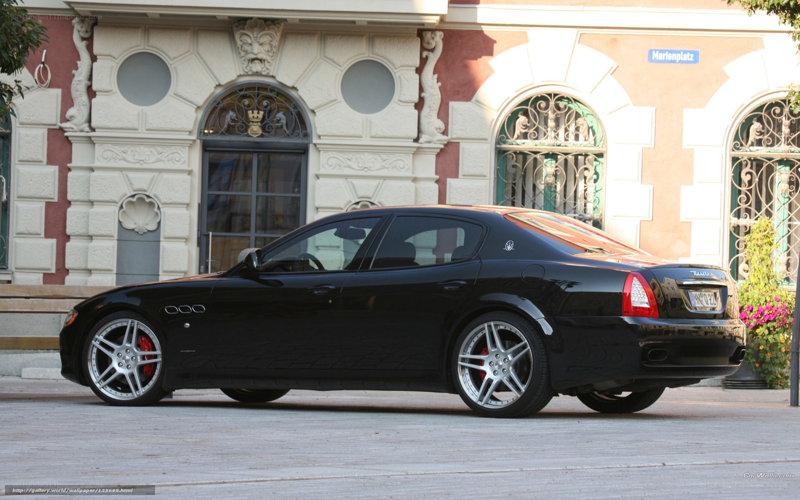 Black Maserati parked on street