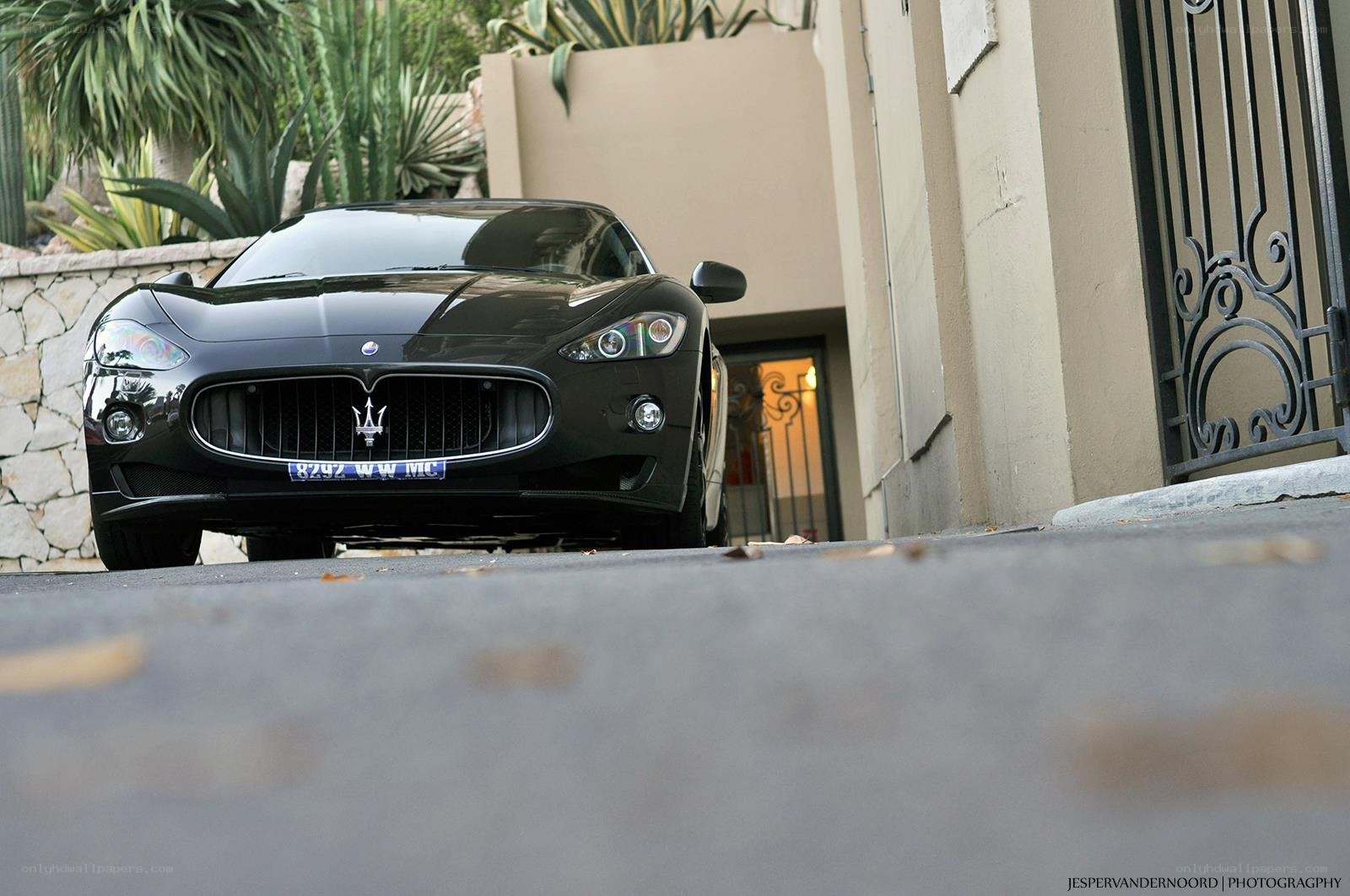 Black Maserati parked outside