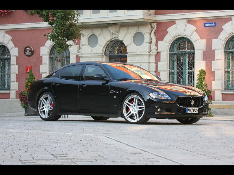 Black Maserati Quattroporte on cobblestones