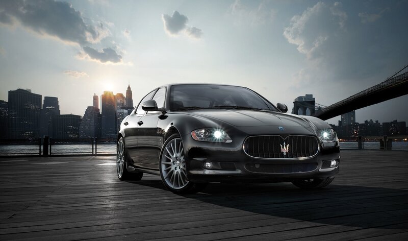 Black Maserati Sedan — City Skyline