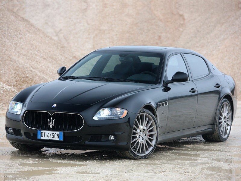 Black Maserati sedan on wet ground