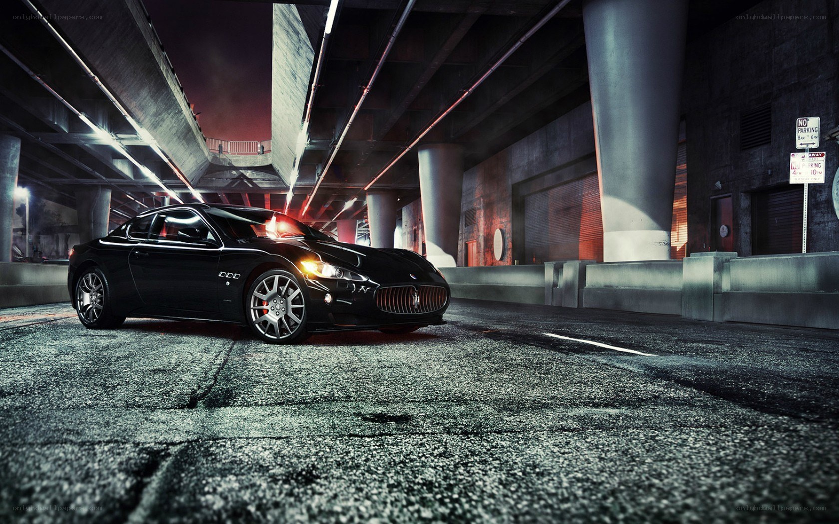 Black Maserati under highway