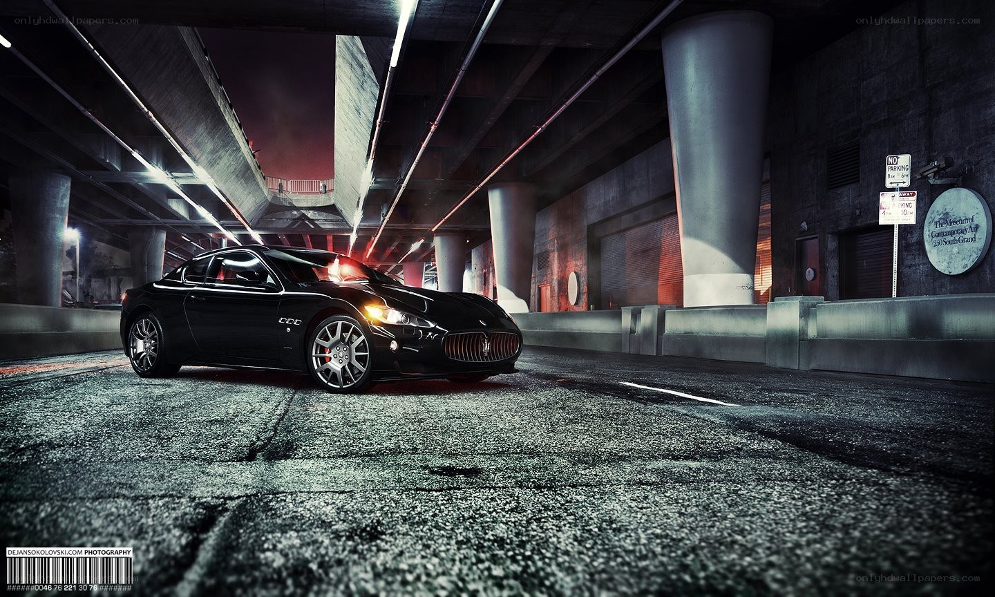 Black Maserati under highway
