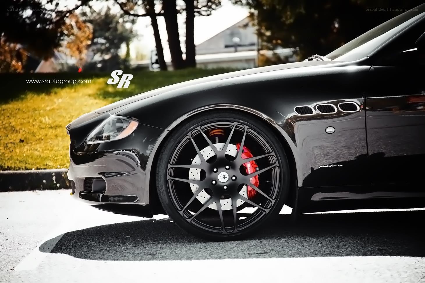 Black Maserati with custom wheels