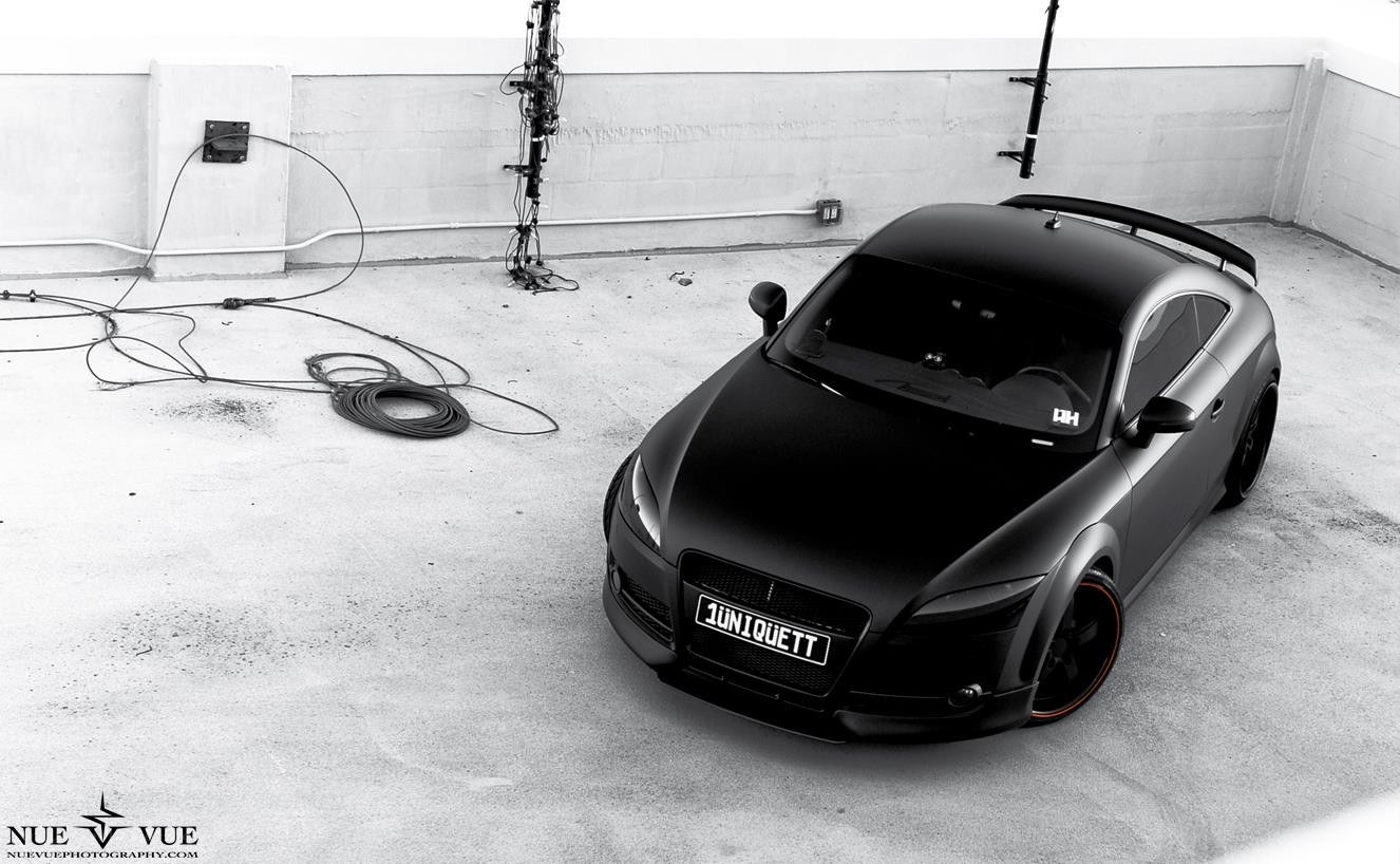 black matte audi tt on rooftop