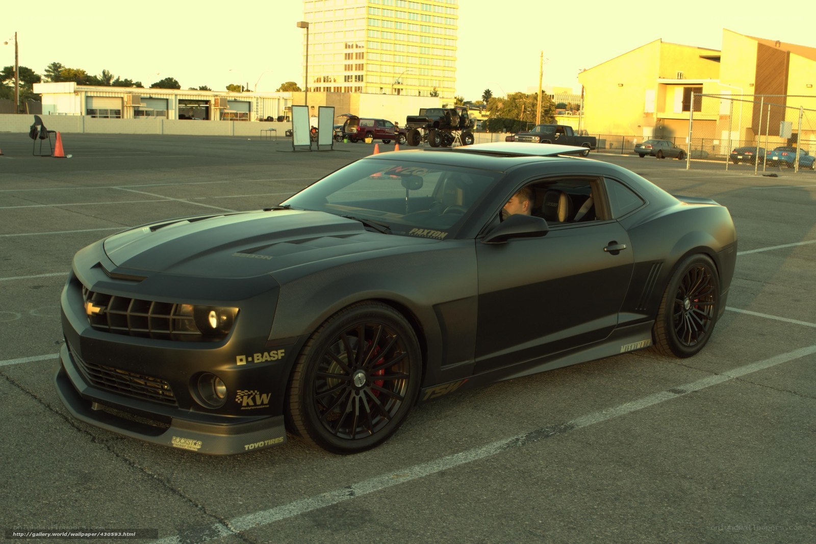 Black matte Camaro in parking lot