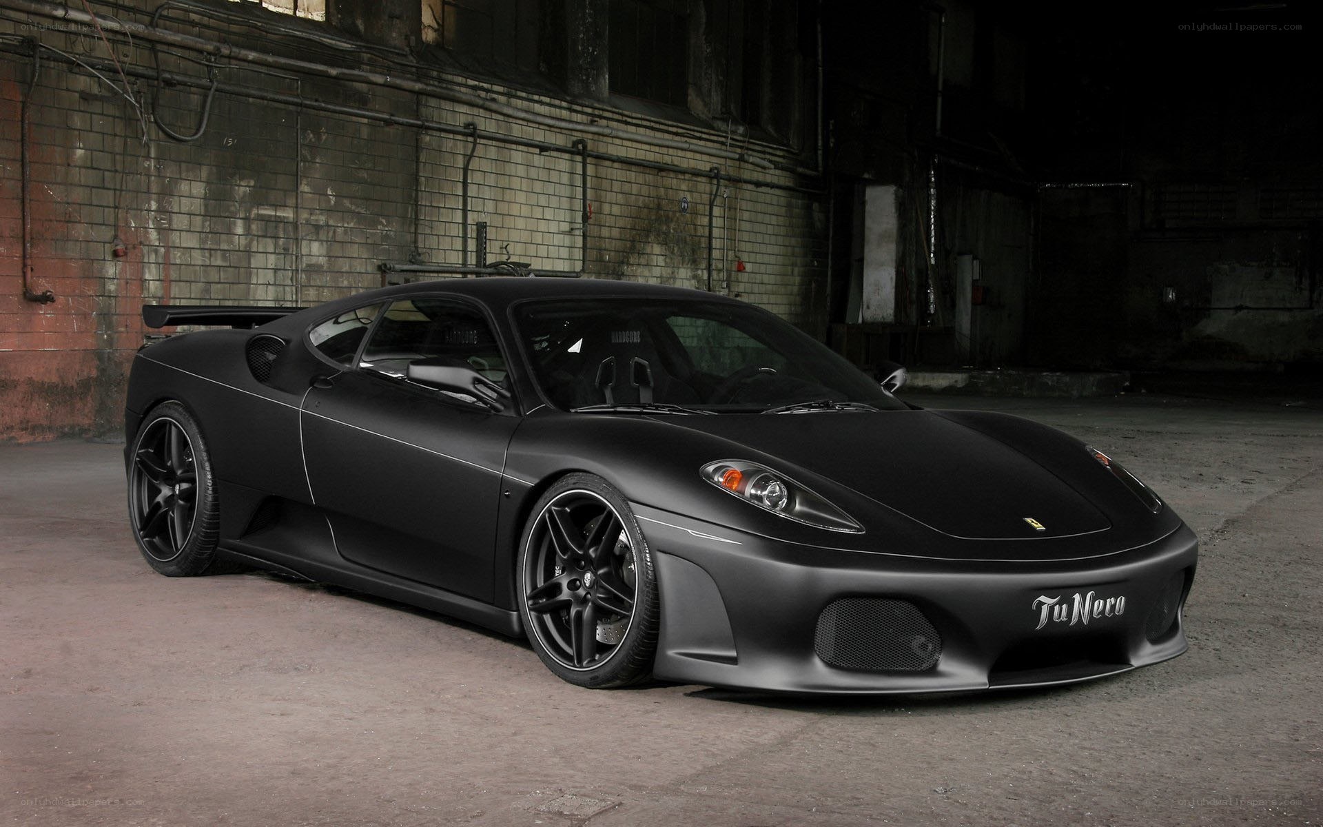 black matte ferrari in warehouse