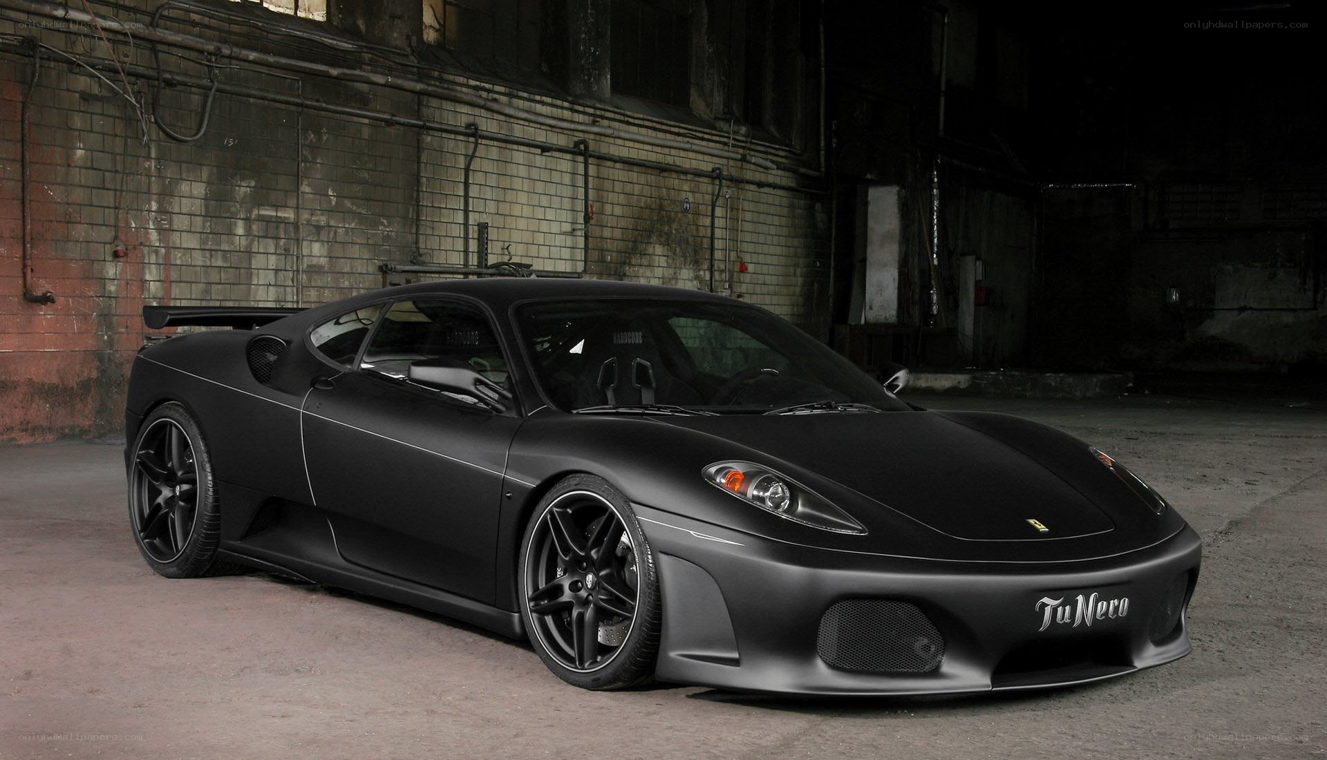 black matte ferrari in warehouse