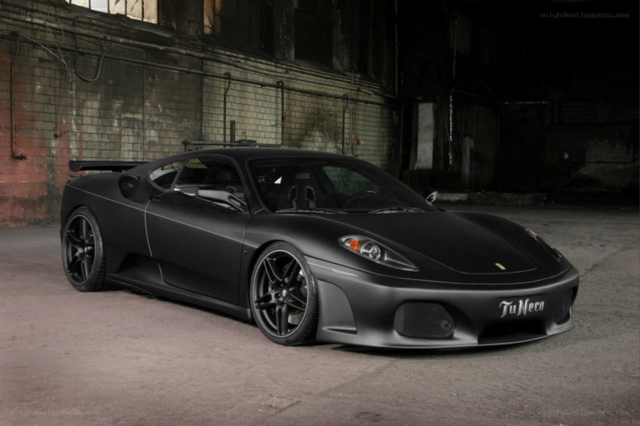 Black matte Ferrari in warehouse