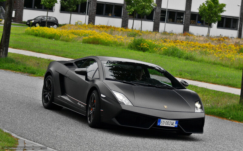 black matte lamborghini on road