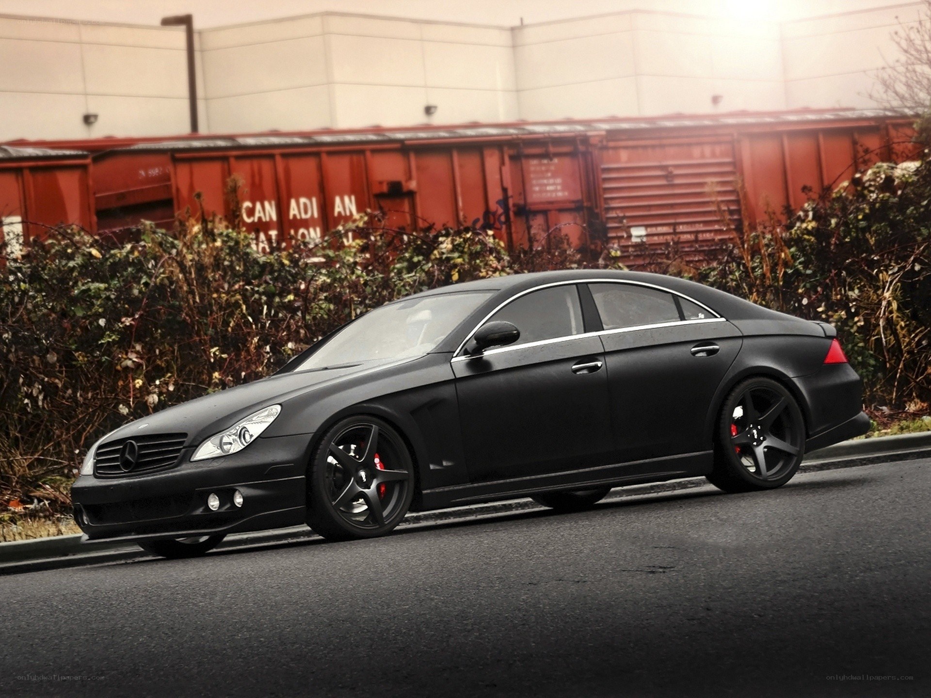 black matte sedan on street