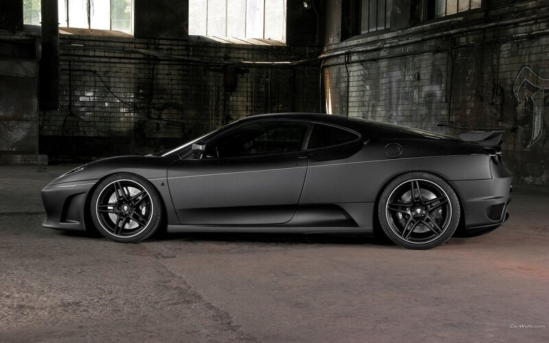 black matte sports car in warehouse