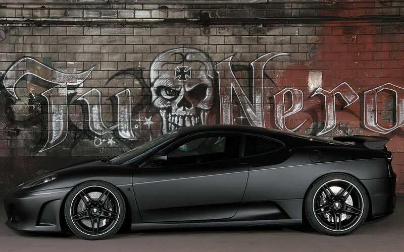 Black matte sports car with graffiti