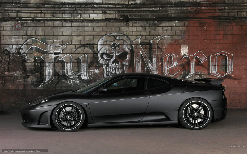 black matte sports car with graffiti