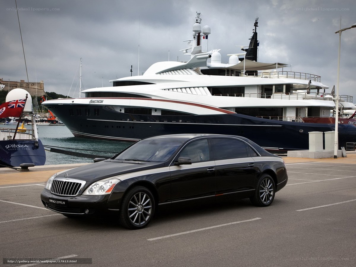Black Maybach and luxury yacht