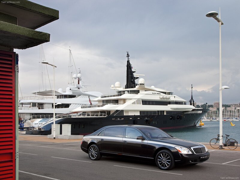 Black Maybach and yacht at marina