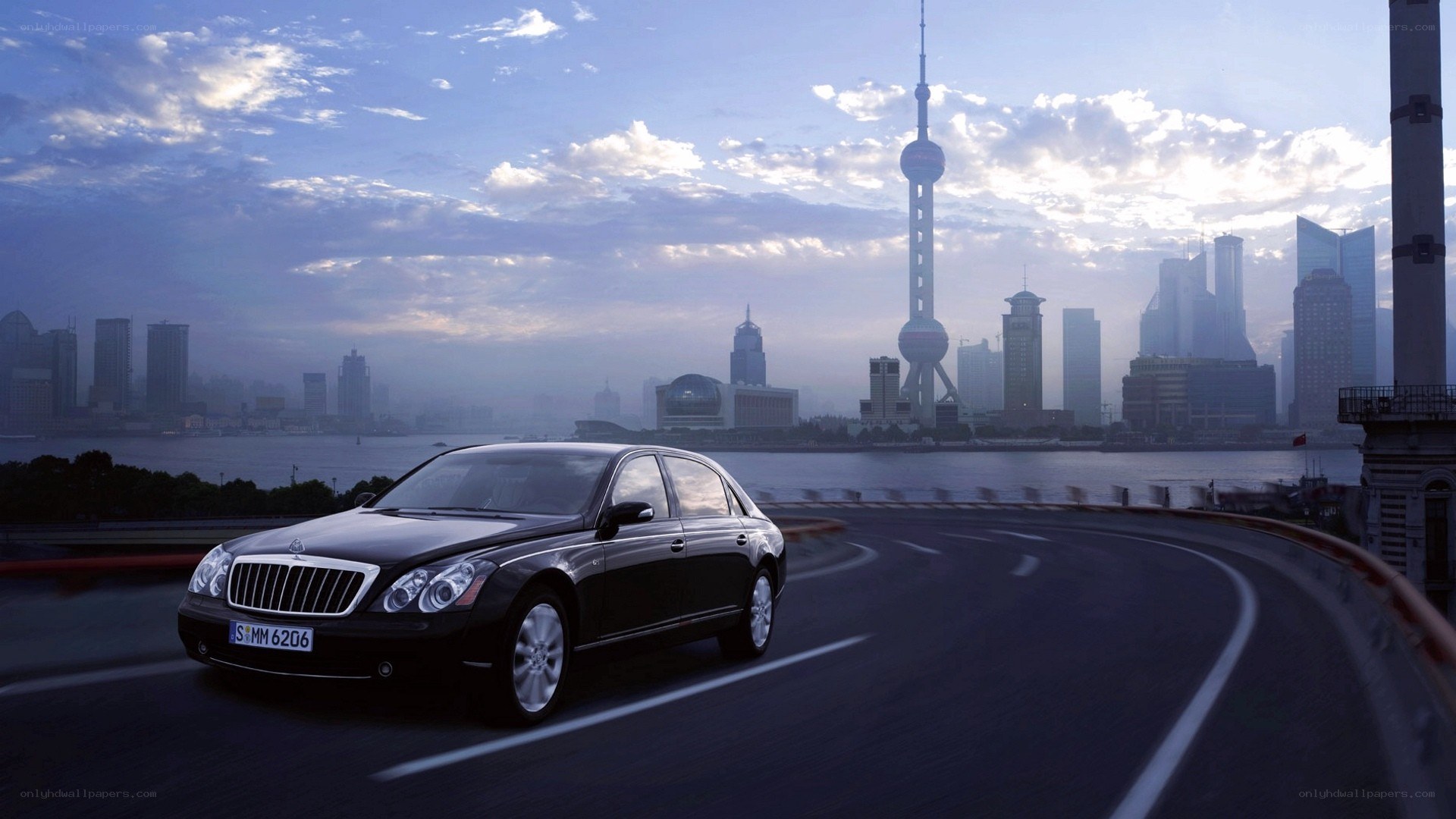 Black Maybach on a city bridge