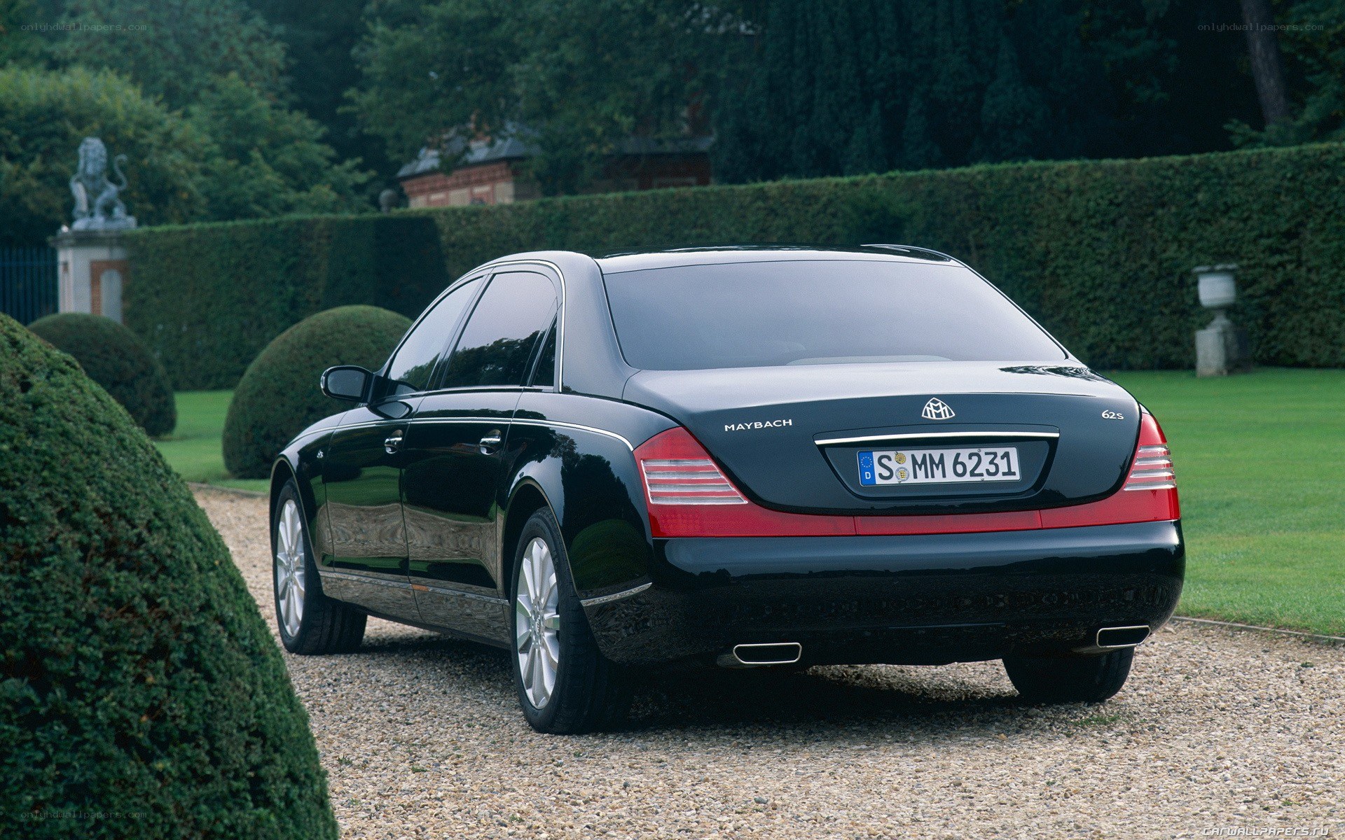 Black Maybach parked in garden