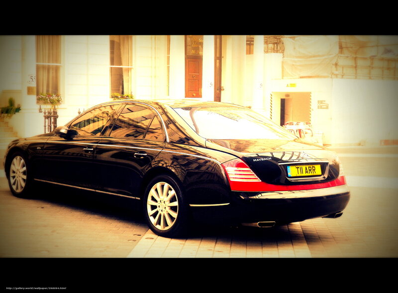Black Maybach parked outside building