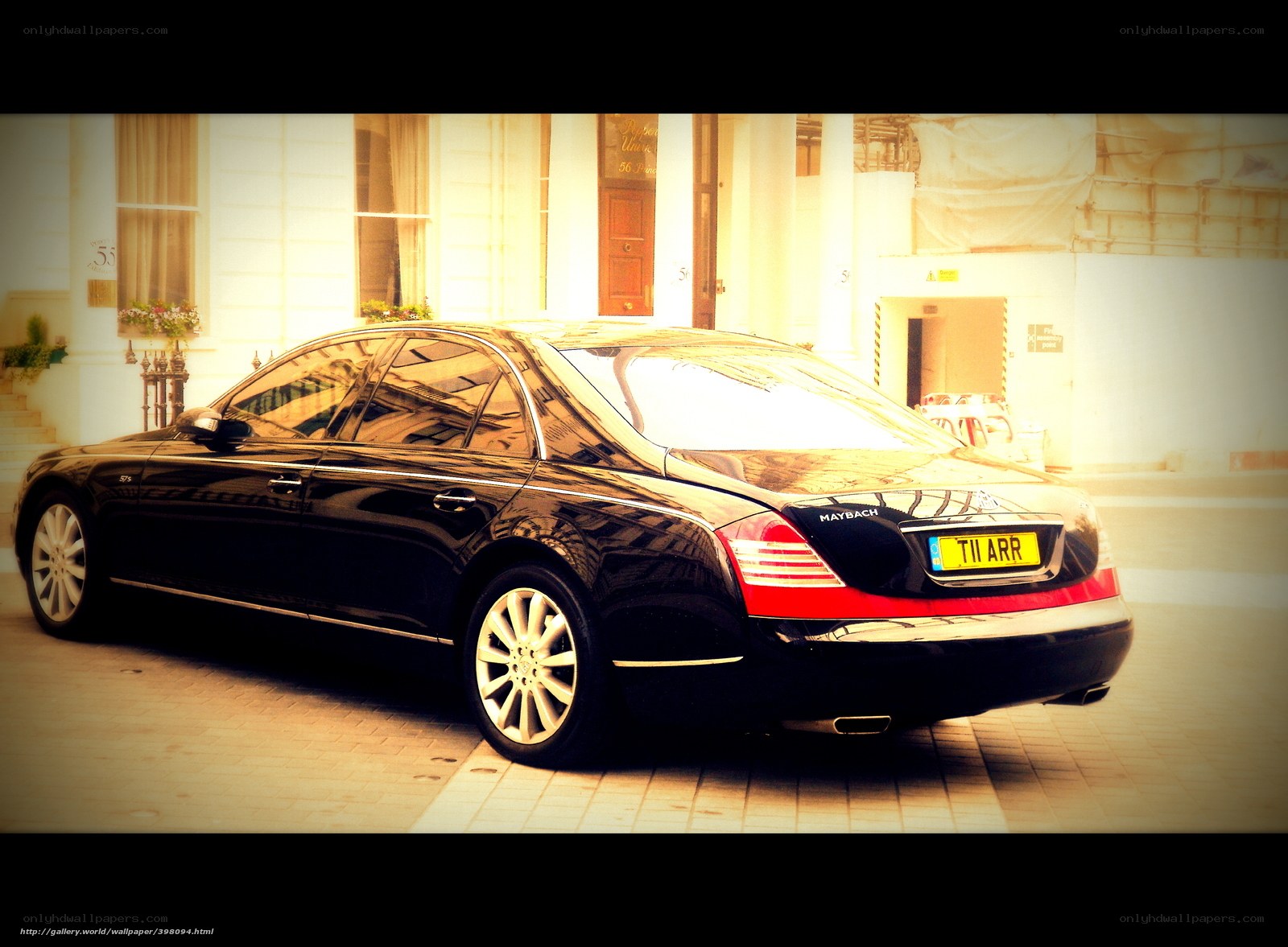 Black Maybach parked outside building
