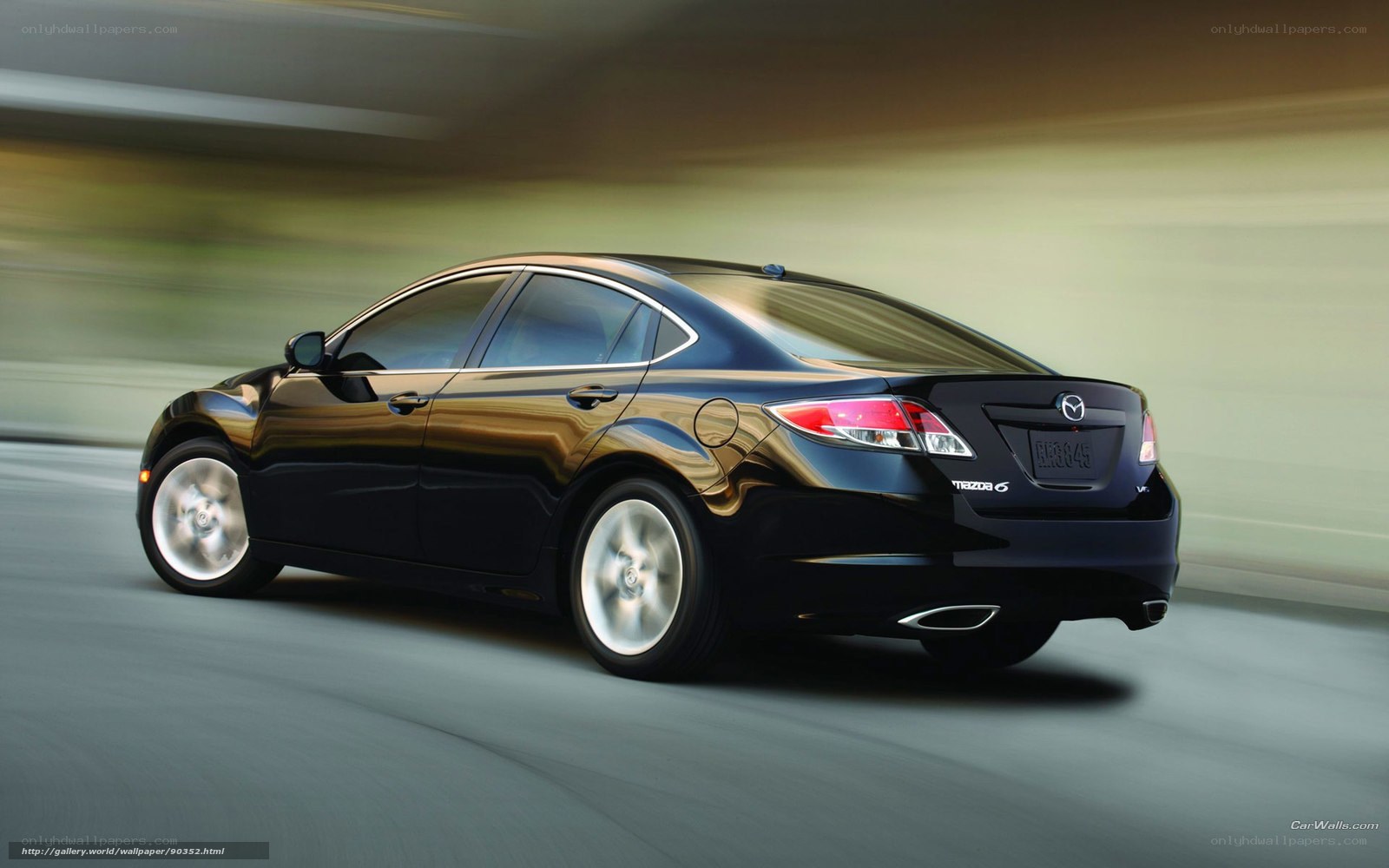 Black Mazda 6 in motion
