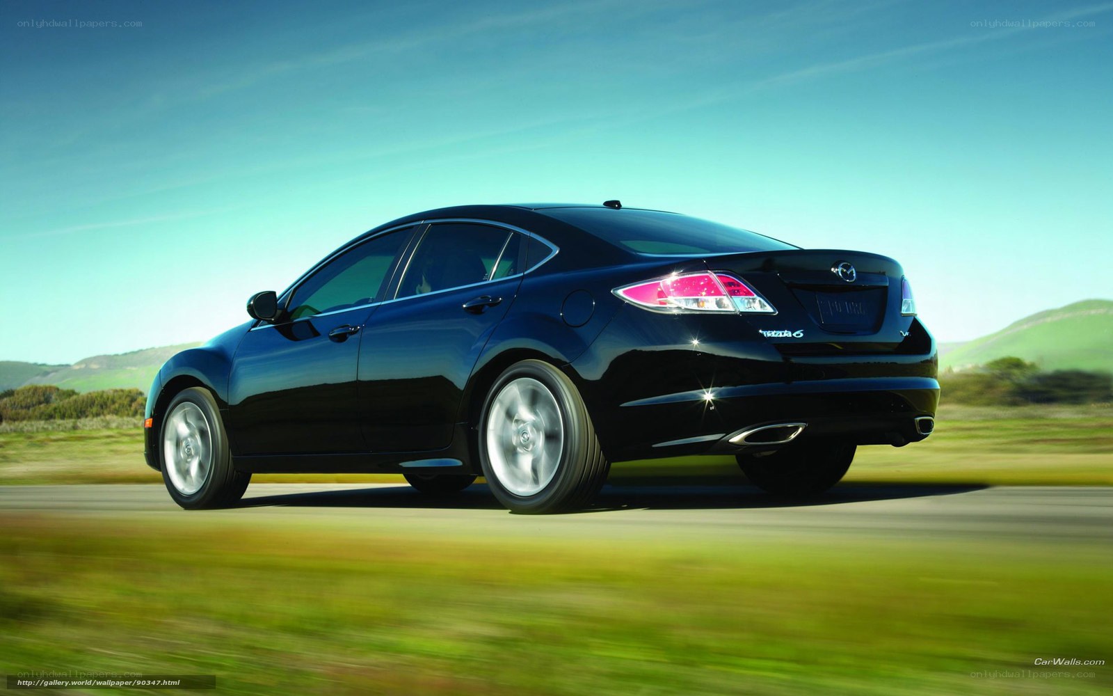 Black Mazda 6 in motion