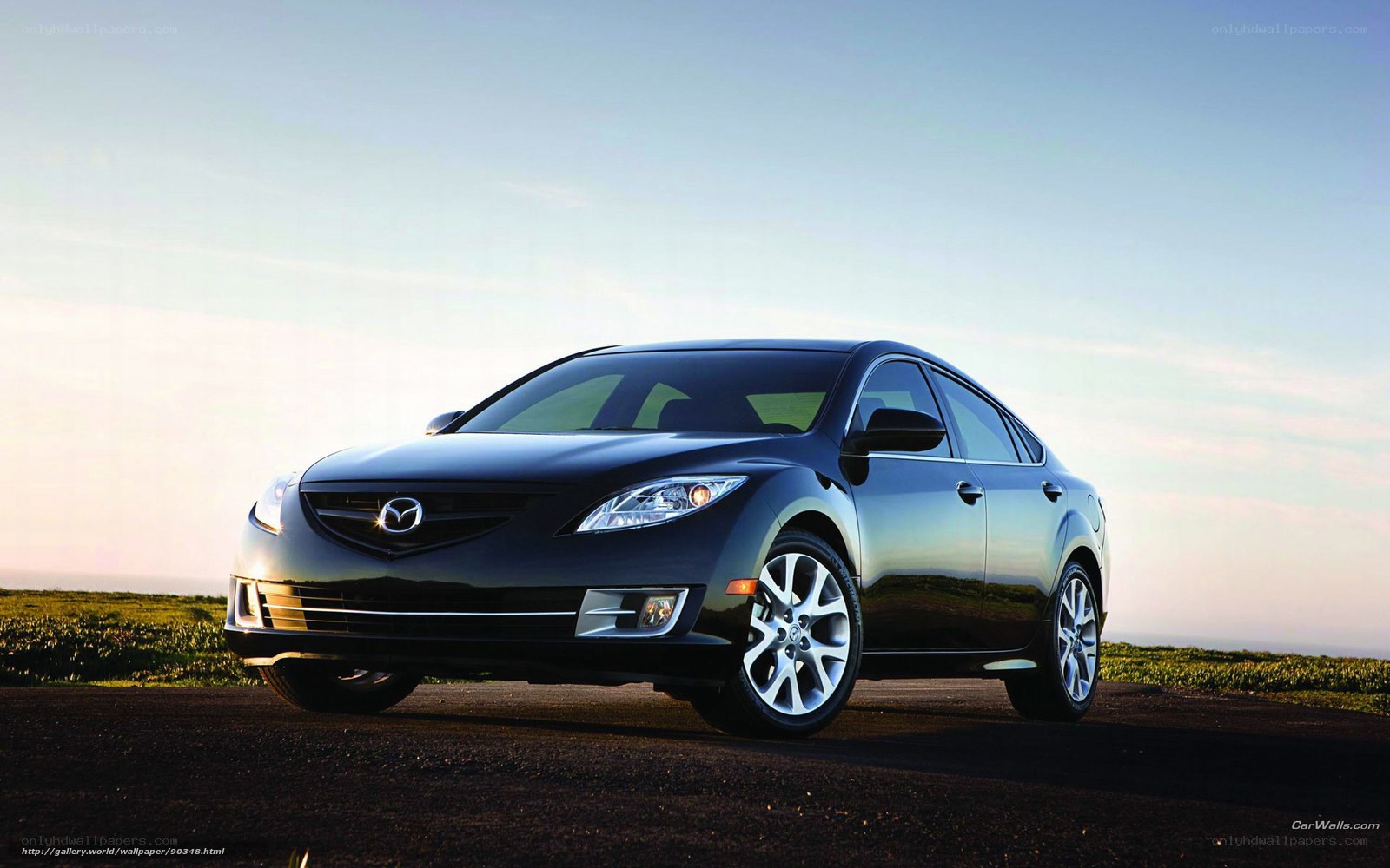 Black Mazda 6 sedan on road