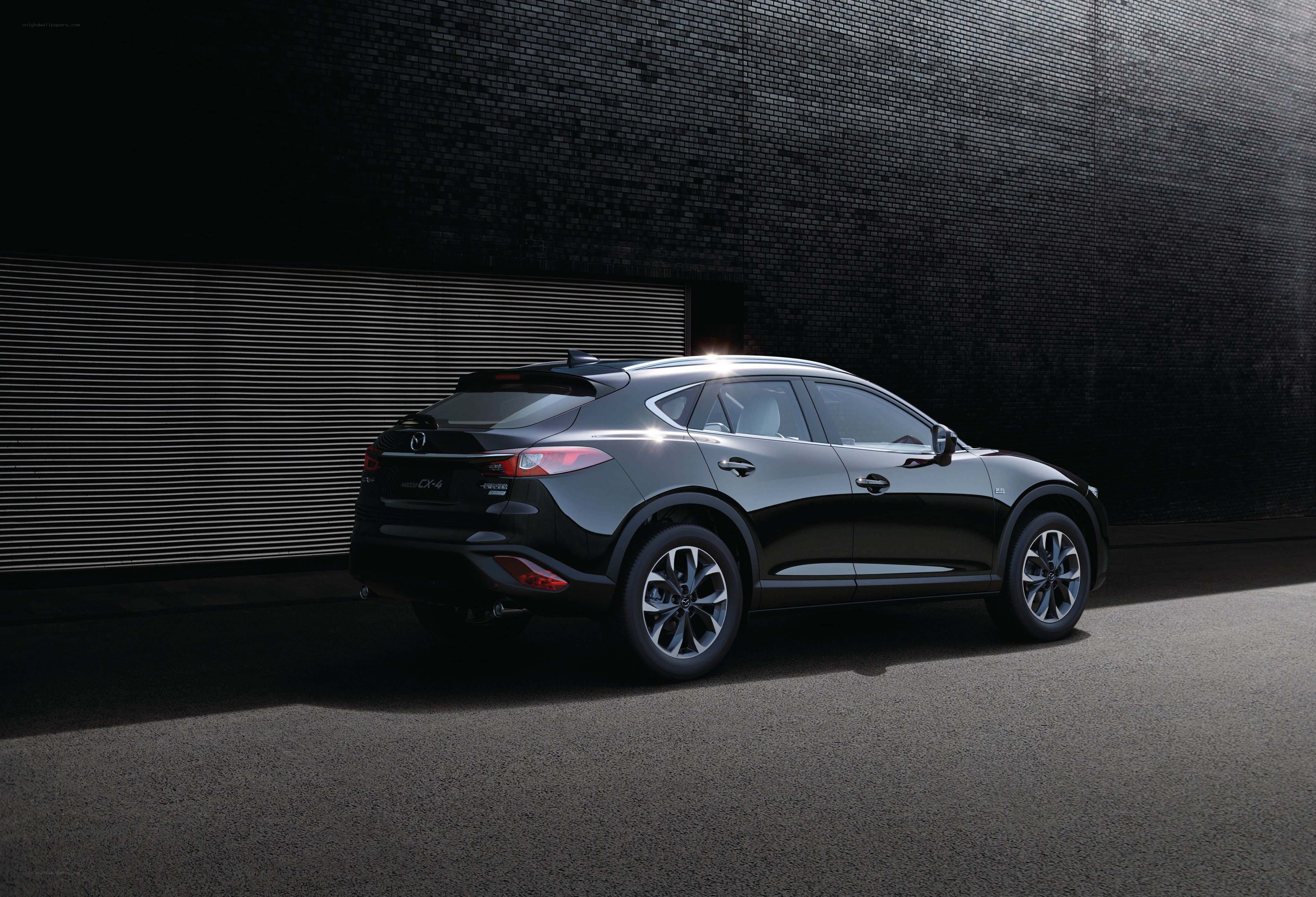 Black Mazda CX-4 in urban setting