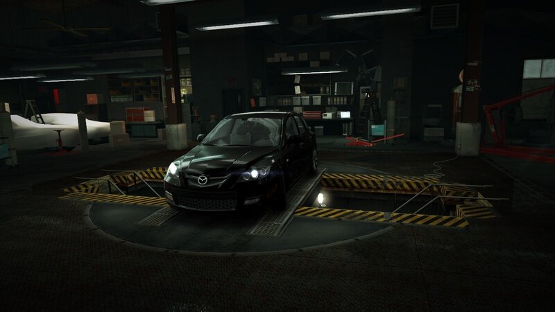 Black Mazda on Lift