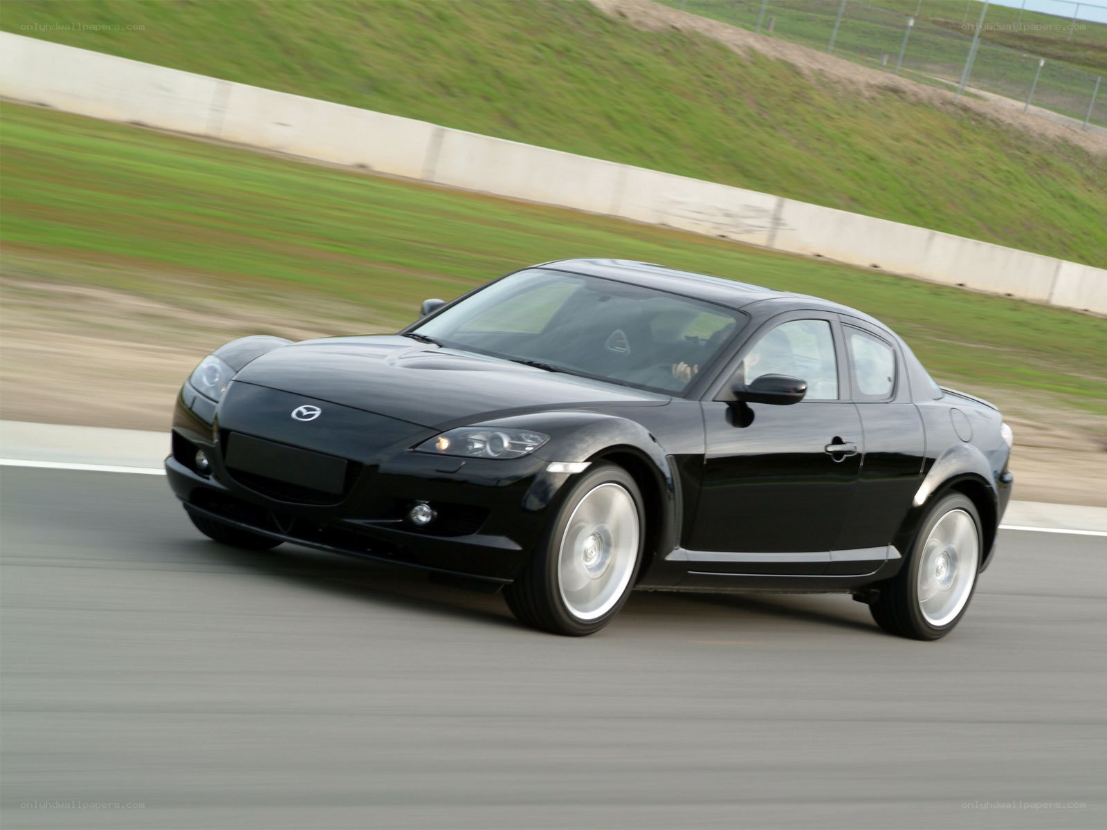 Black Mazda RX-8 on a racetrack