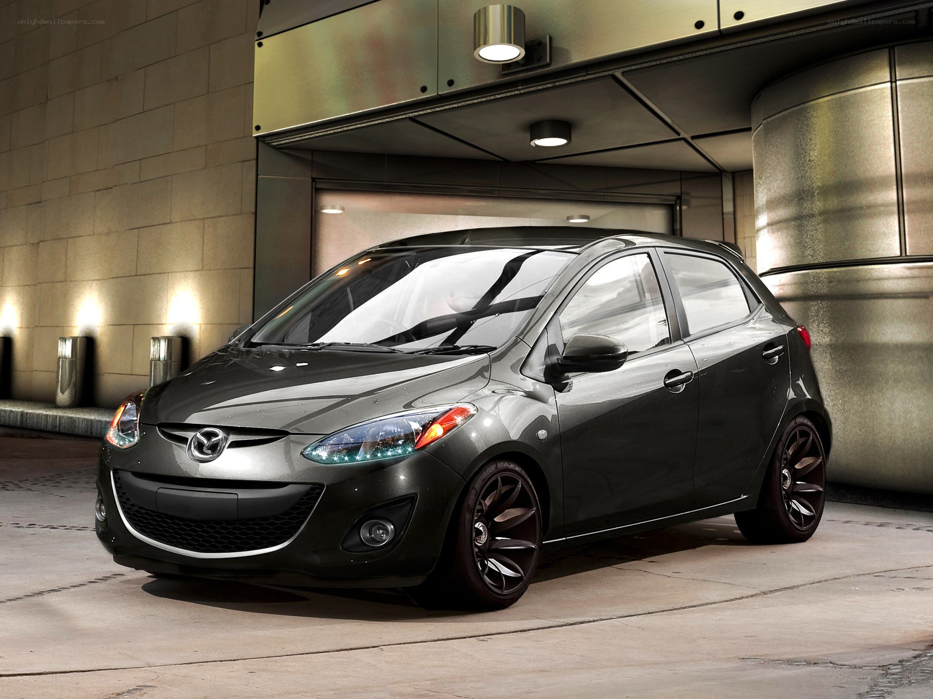 Black Mazda2 hatchback car