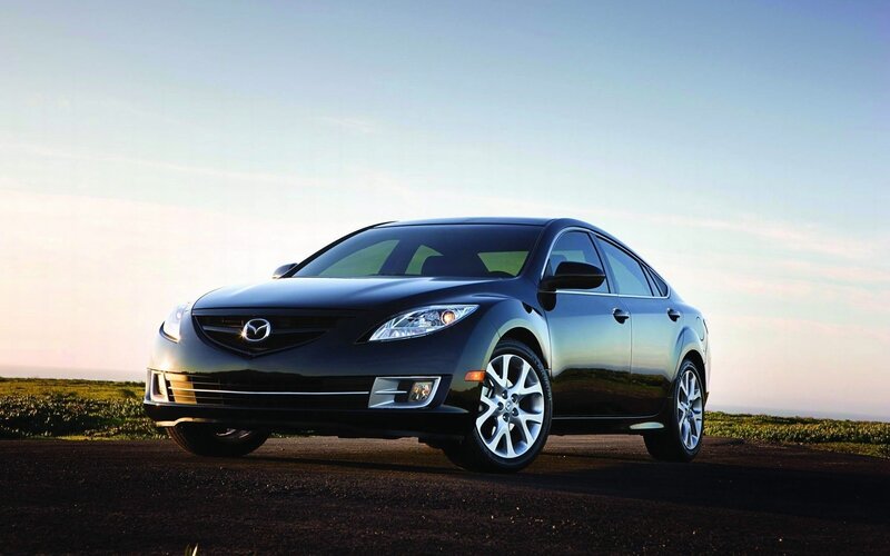 Black Mazda6 sedan on road
