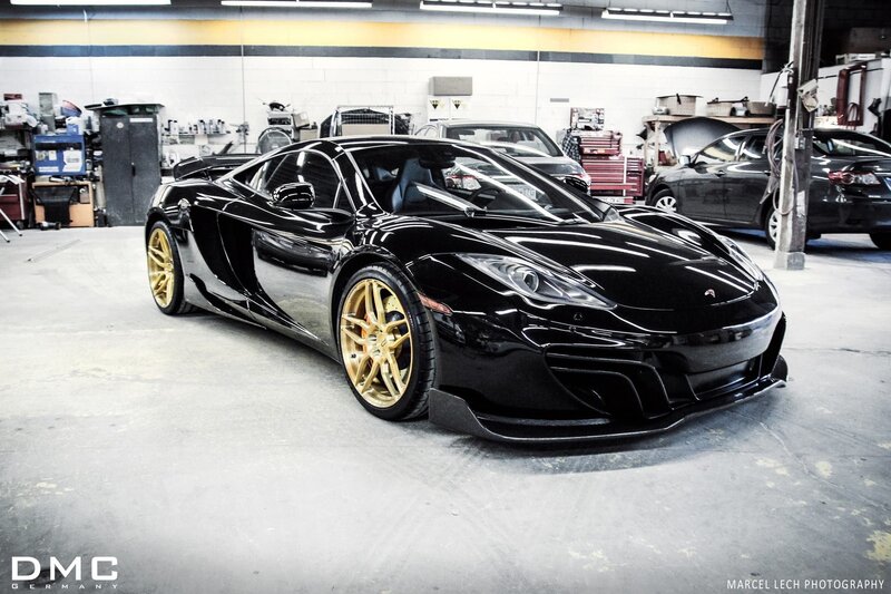 Black McLaren in a garage
