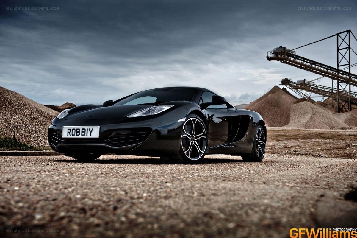 Black McLaren in industrial setting