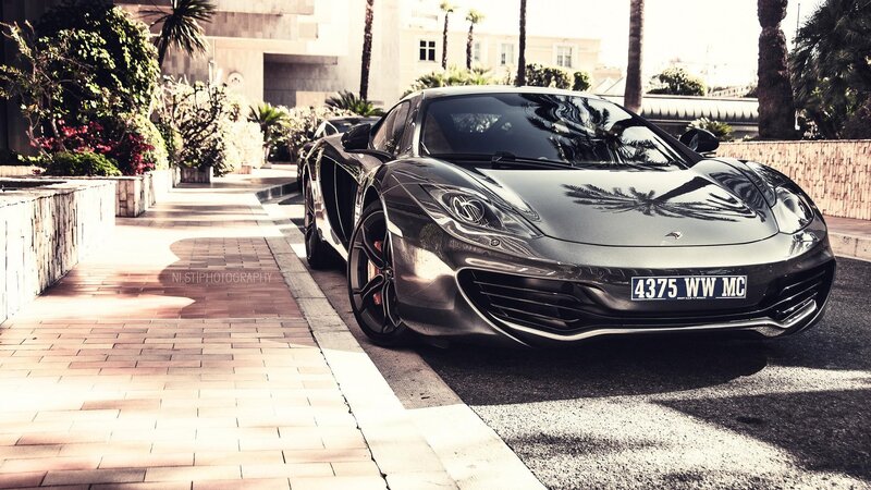 Black McLaren sports car on a street