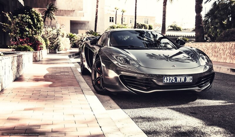 Black McLaren sports car on street