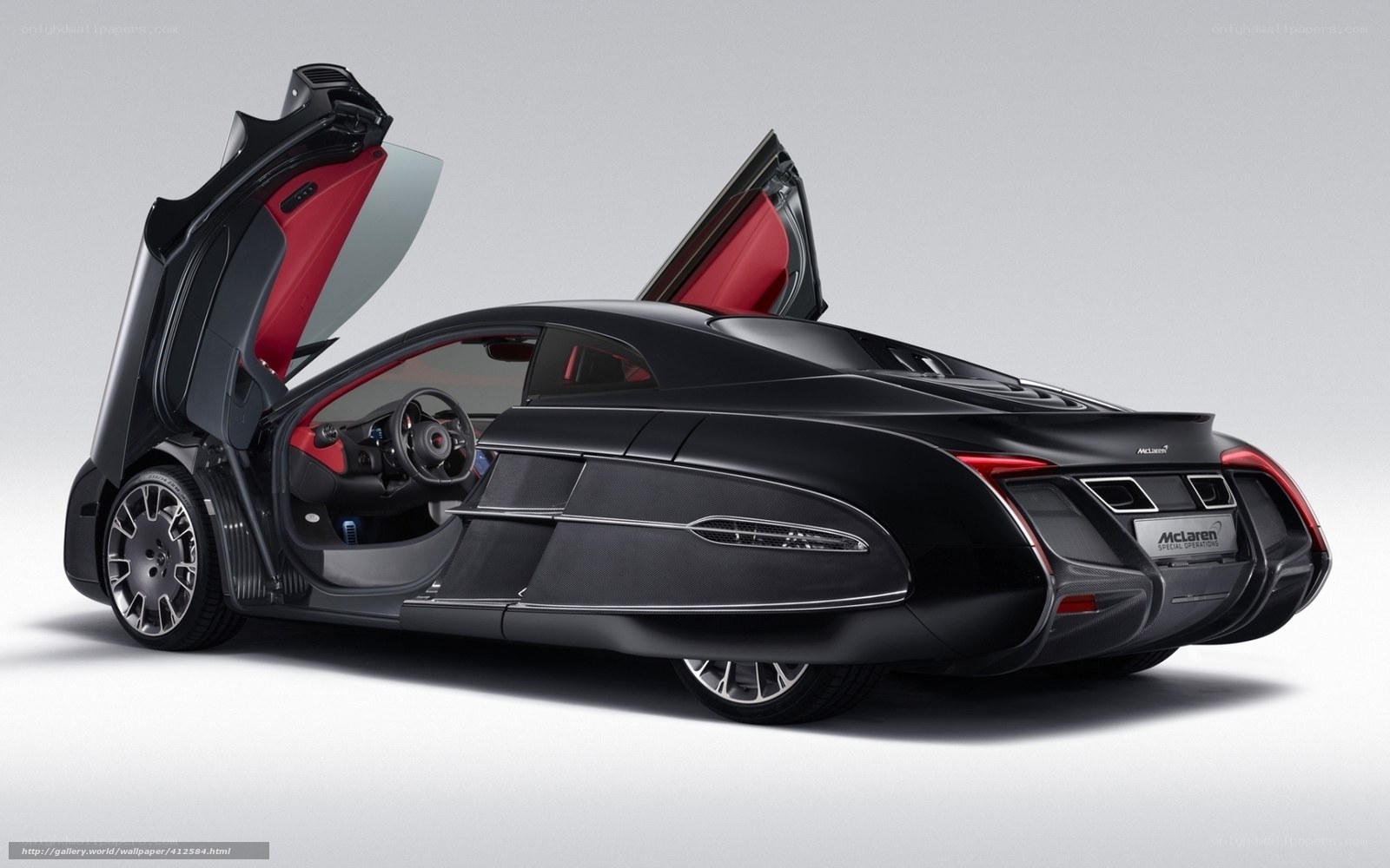Black McLaren with doors open