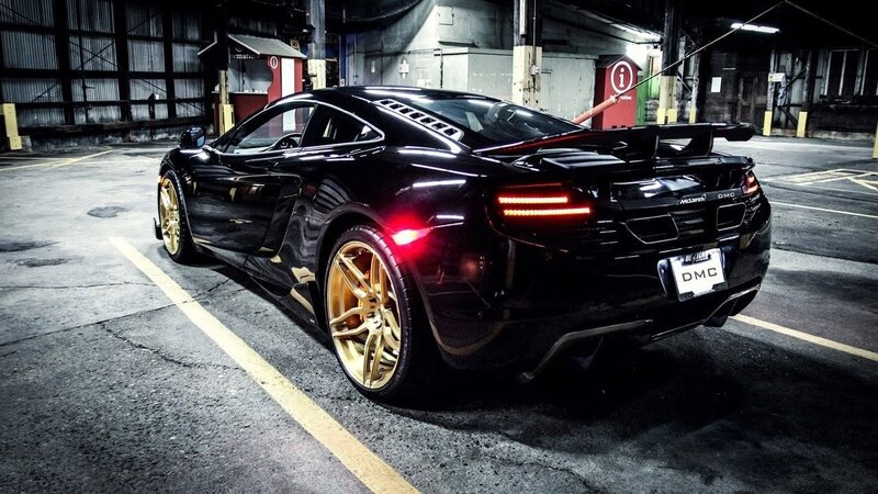 black mclaren with gold wheels