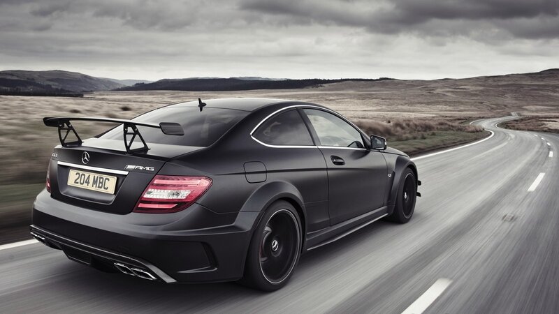Black Mercedes-AMG on a winding road