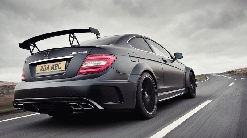 black mercedes amg on road