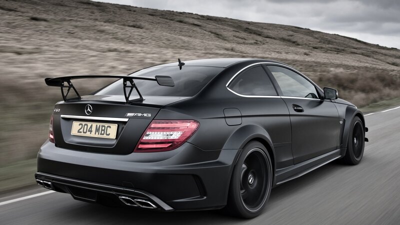 black mercedes amg on road