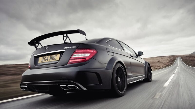 black mercedes amg on road